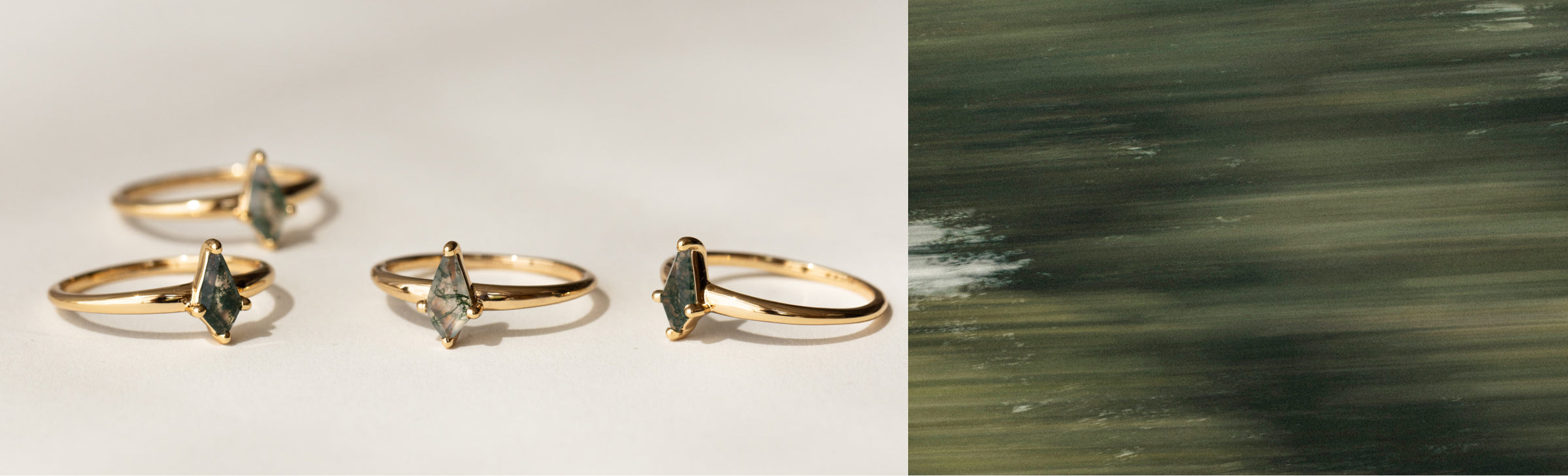 gold rings with marquise-cut dark green gemstones