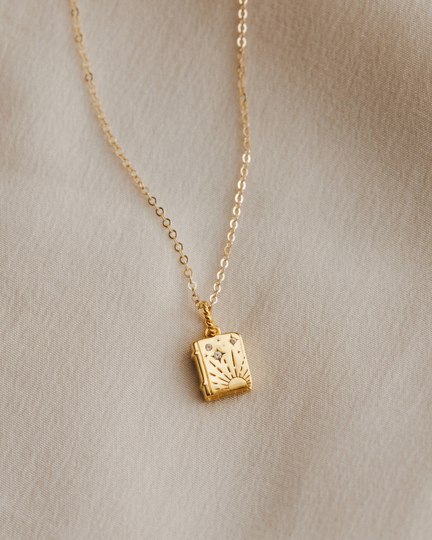 Tiny book charm with gemstones