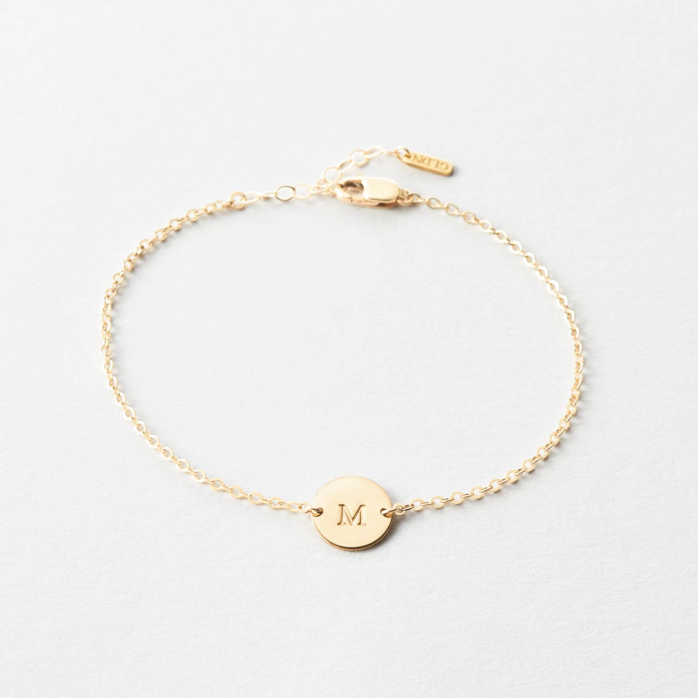 Personalized monogram bracelet with hand engraved family initials in  Sterling Silver, Yellow Gold or Rose Gold.